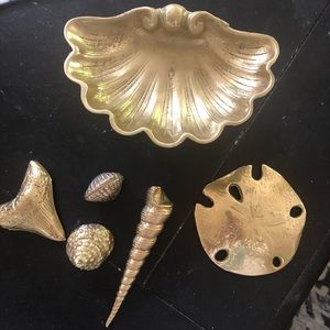 Brass shell pedestal dish with brass shells.